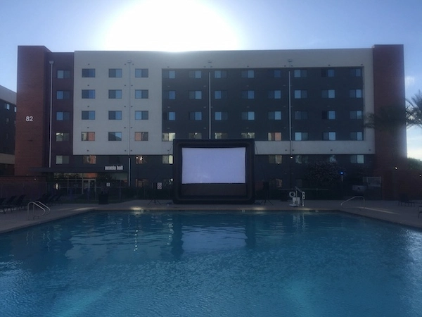 Backyard inflatable movie screen during evening