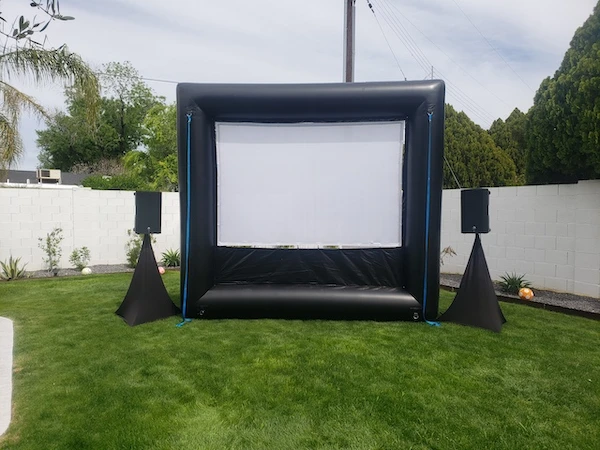 Inflatable outdoor movie screen at a community event