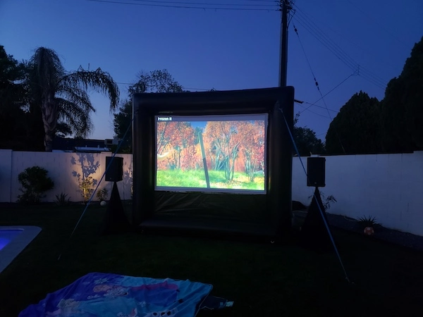 Neighborhood outdoor movie night with inflatable screen